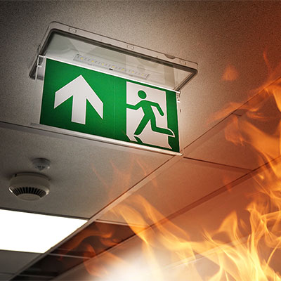 Emergency exit signage in building on fire